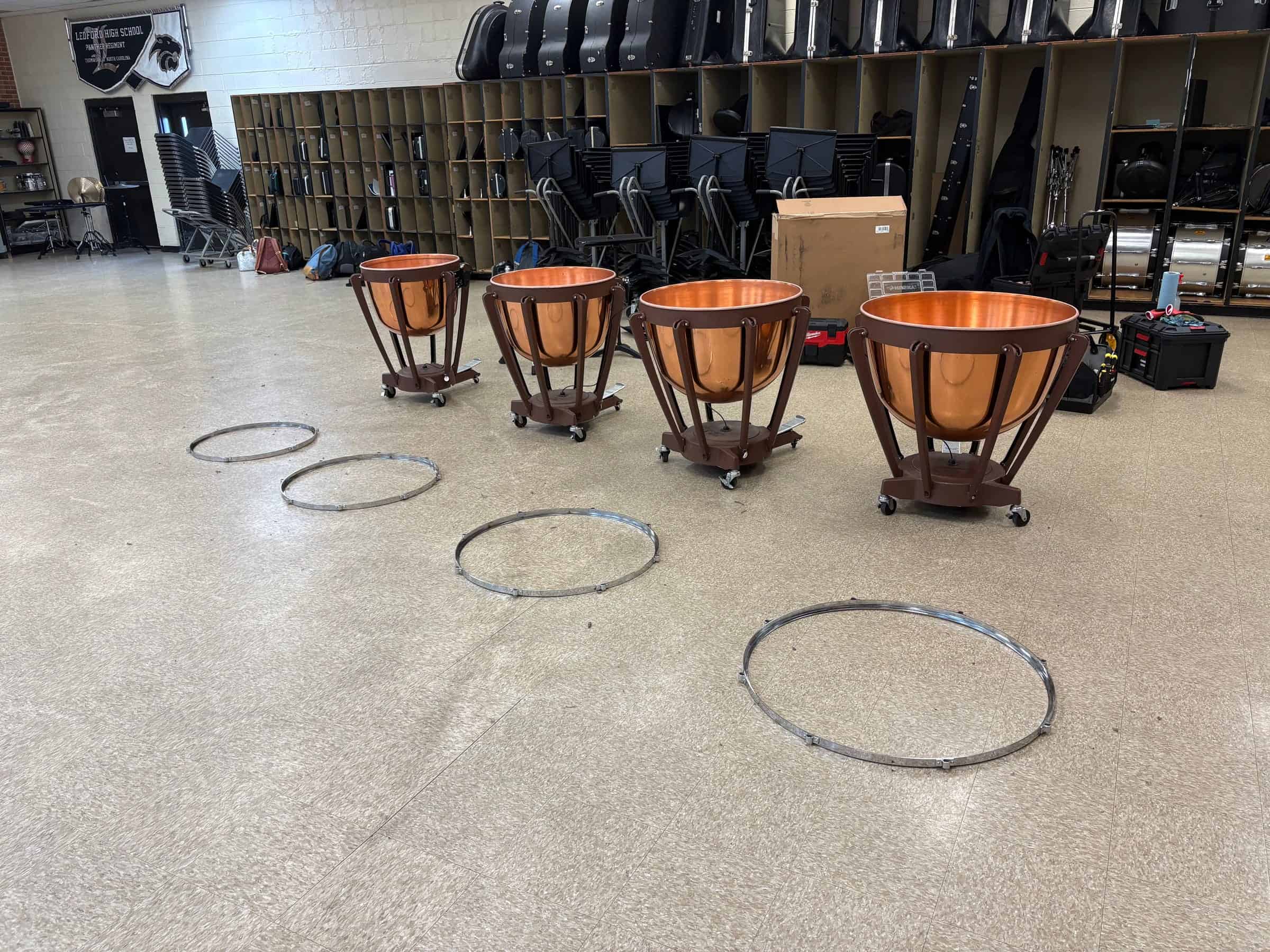 Percussion technician changing timpani heads
