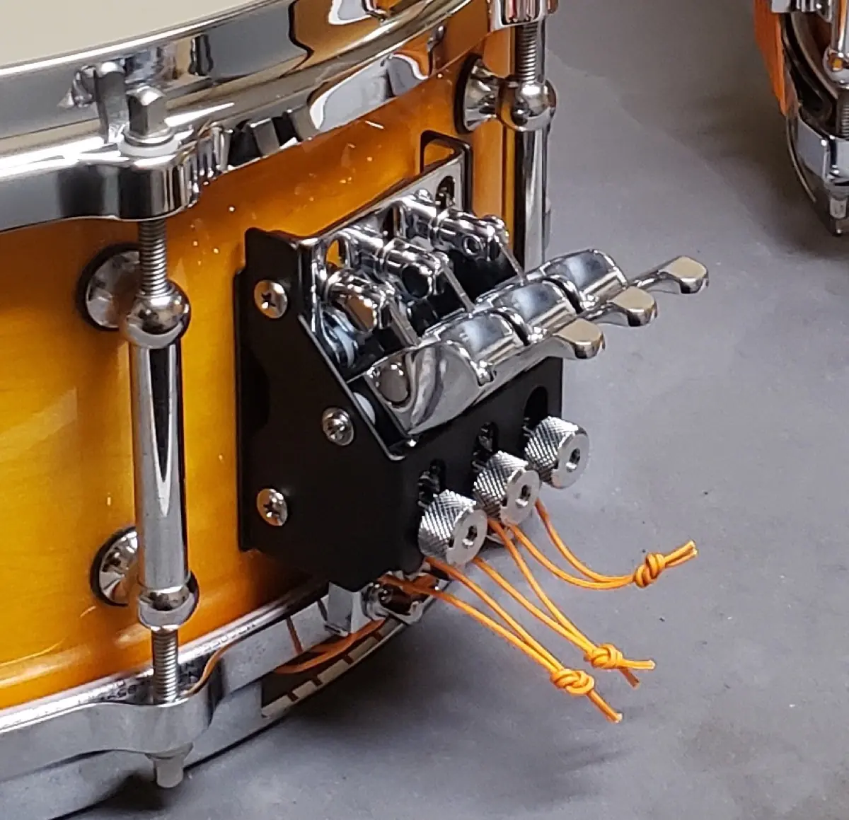 The same concert snare with a new throw-off fitted and fresh snare cables