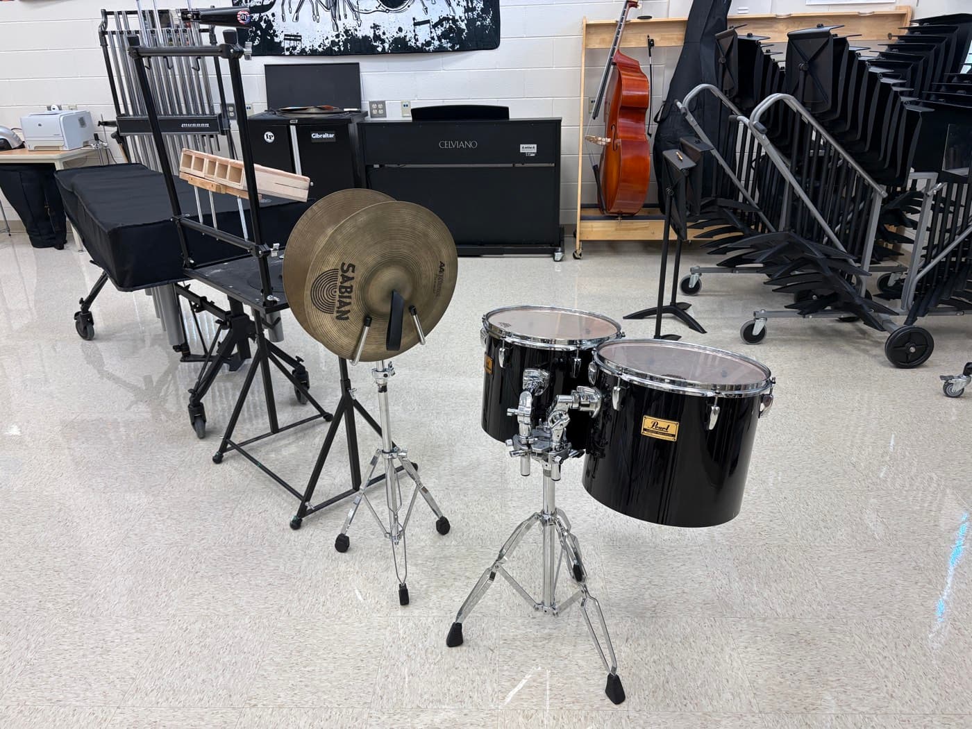 Concert toms, crash cymbals, and chimes in a band hall, covered under the Concert Tuning Package