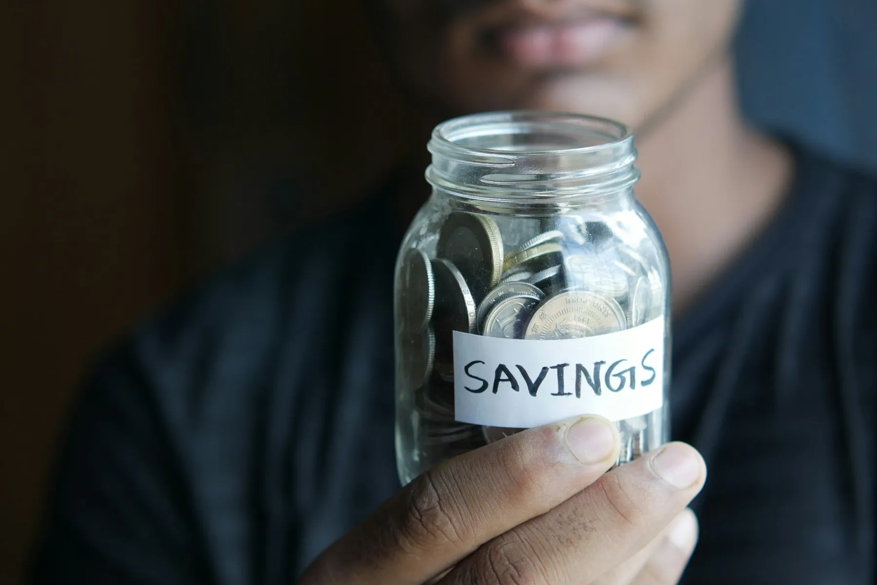 Jar of coins labeled savings