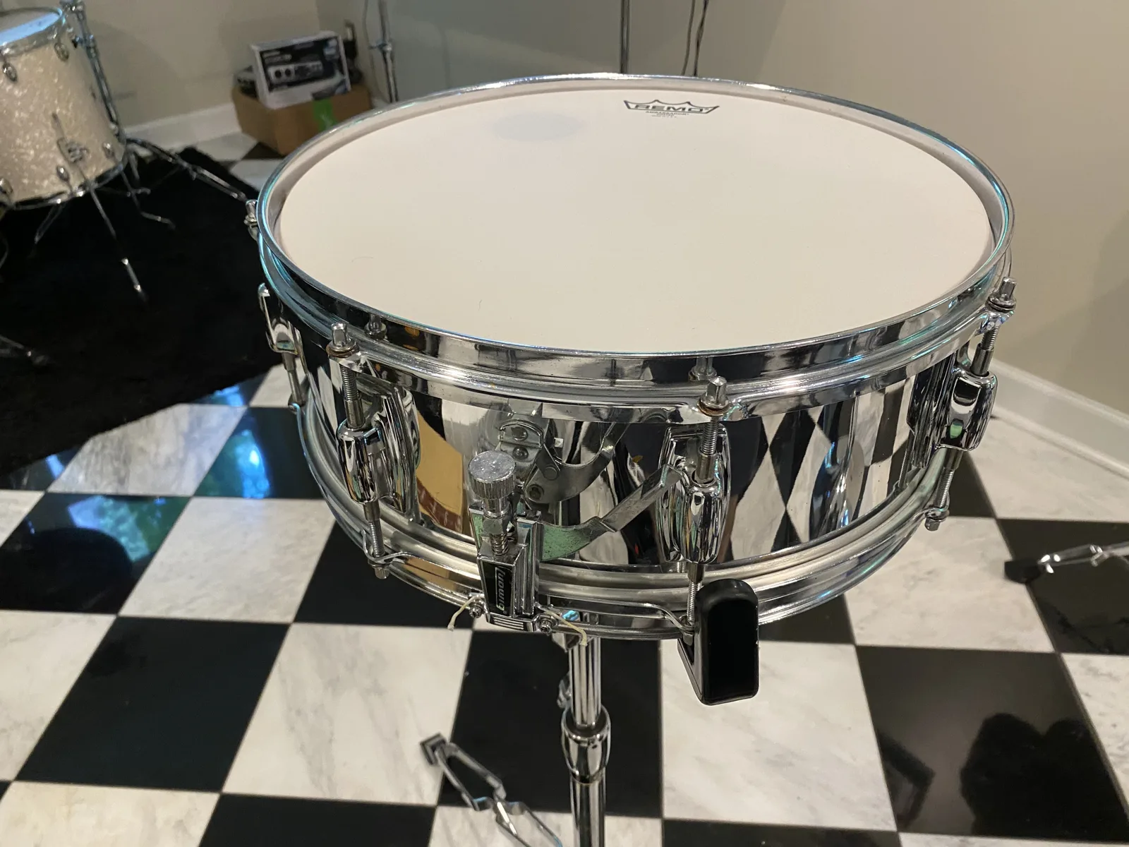 Ludwig drum-kit snare with a fresh Remo Ambassador coated head, tuned and back on its stand